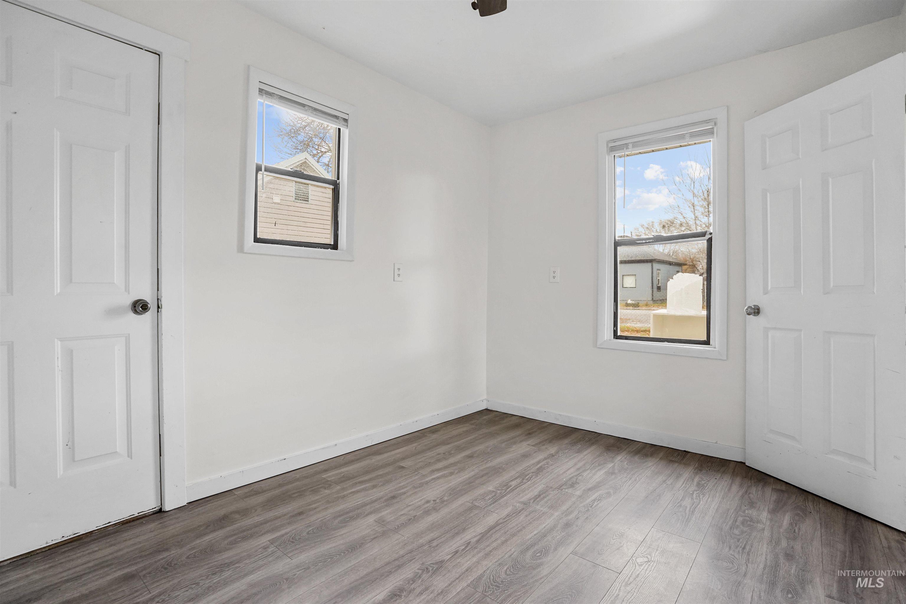 324 Linden Street Rupert, ID 83350 - Photo 9 of 13 Unfurnished bedroom with wood finished floors and a ceiling fan