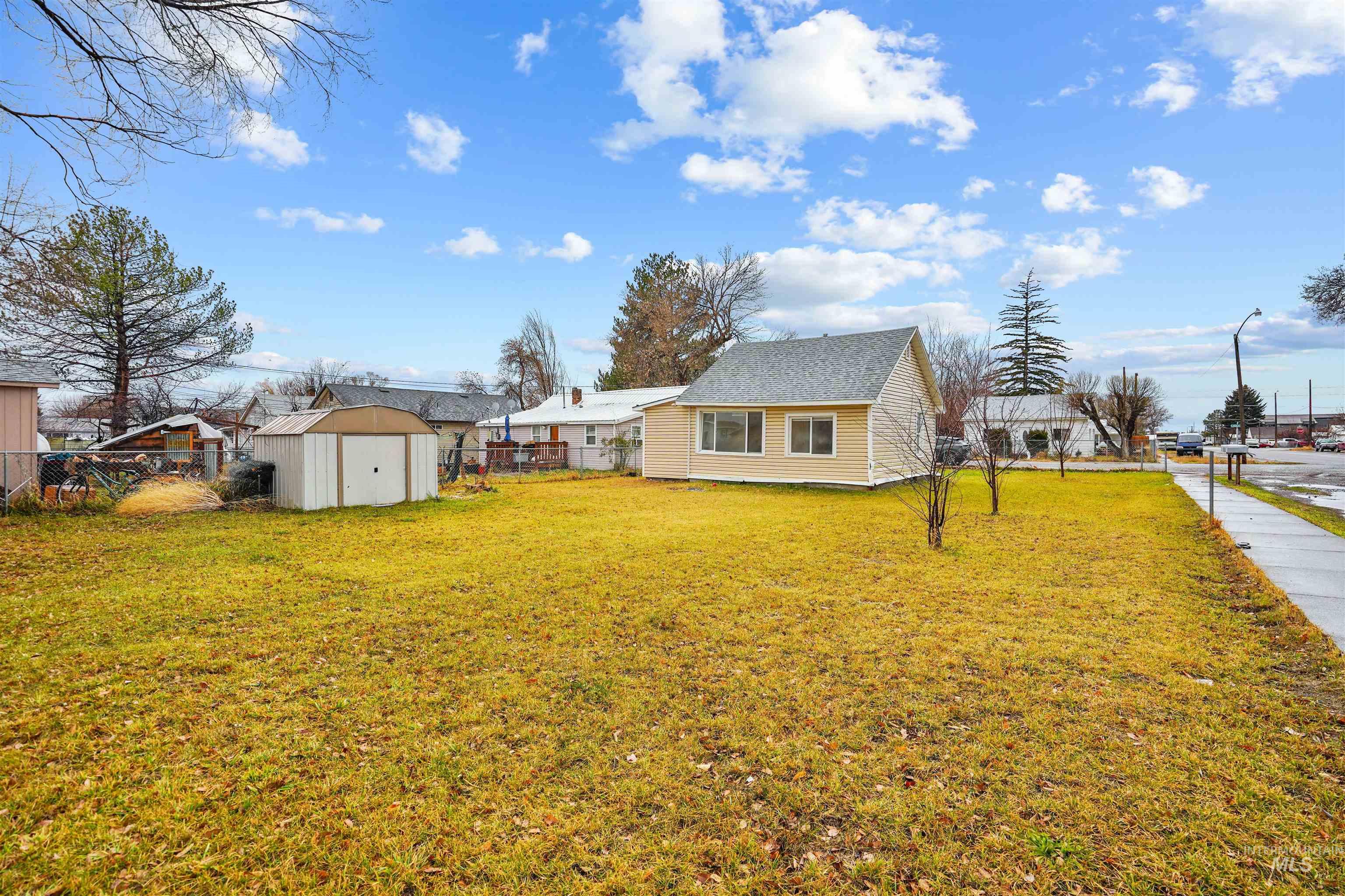 324 Linden Street Rupert, ID 83350 - Photo 10 of 13 Fenced backyard with a storage shed