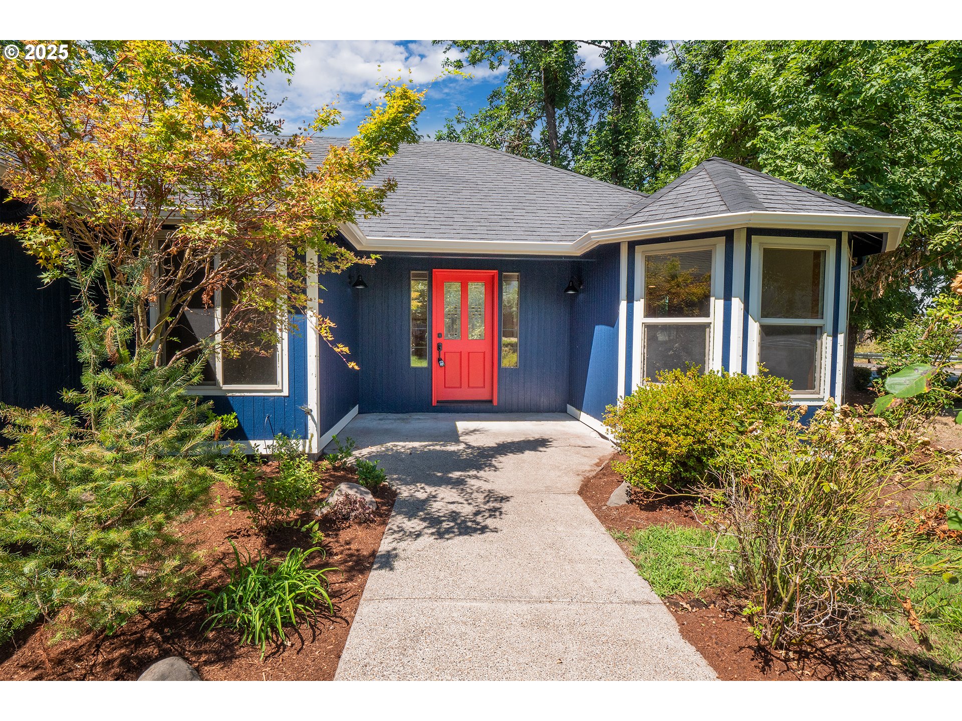 6894 C Street Springfield, OR 97478 - Photo 1 of 32 a front view of a house with a yard