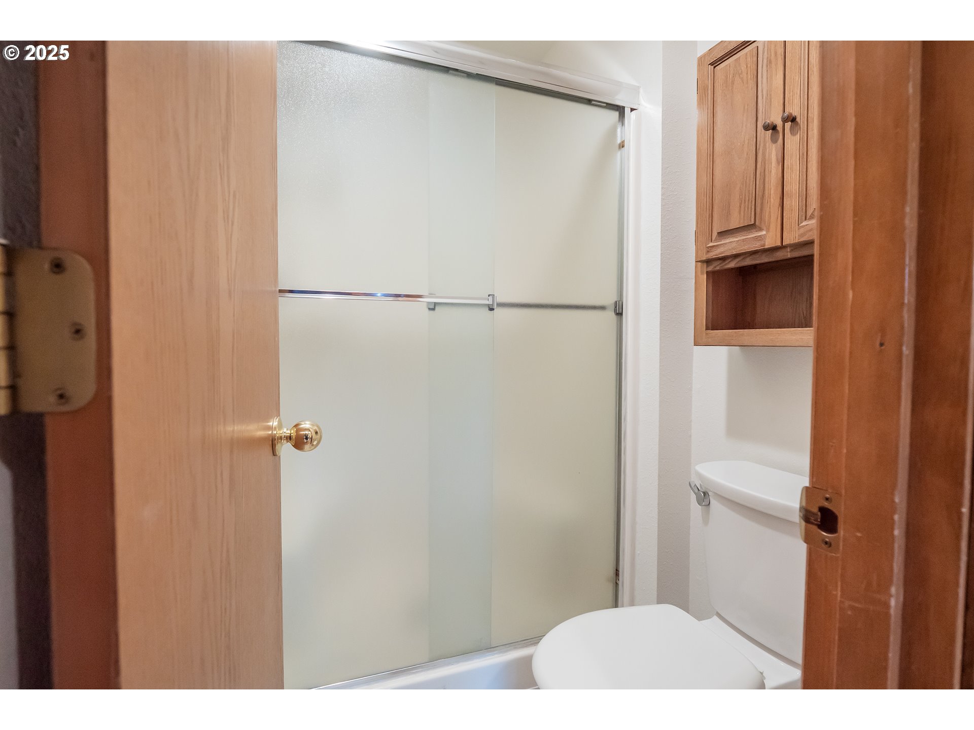 6894 C Street Springfield, OR 97478 - Photo 24 of 32 a bathroom with a shower and a wooden floor
