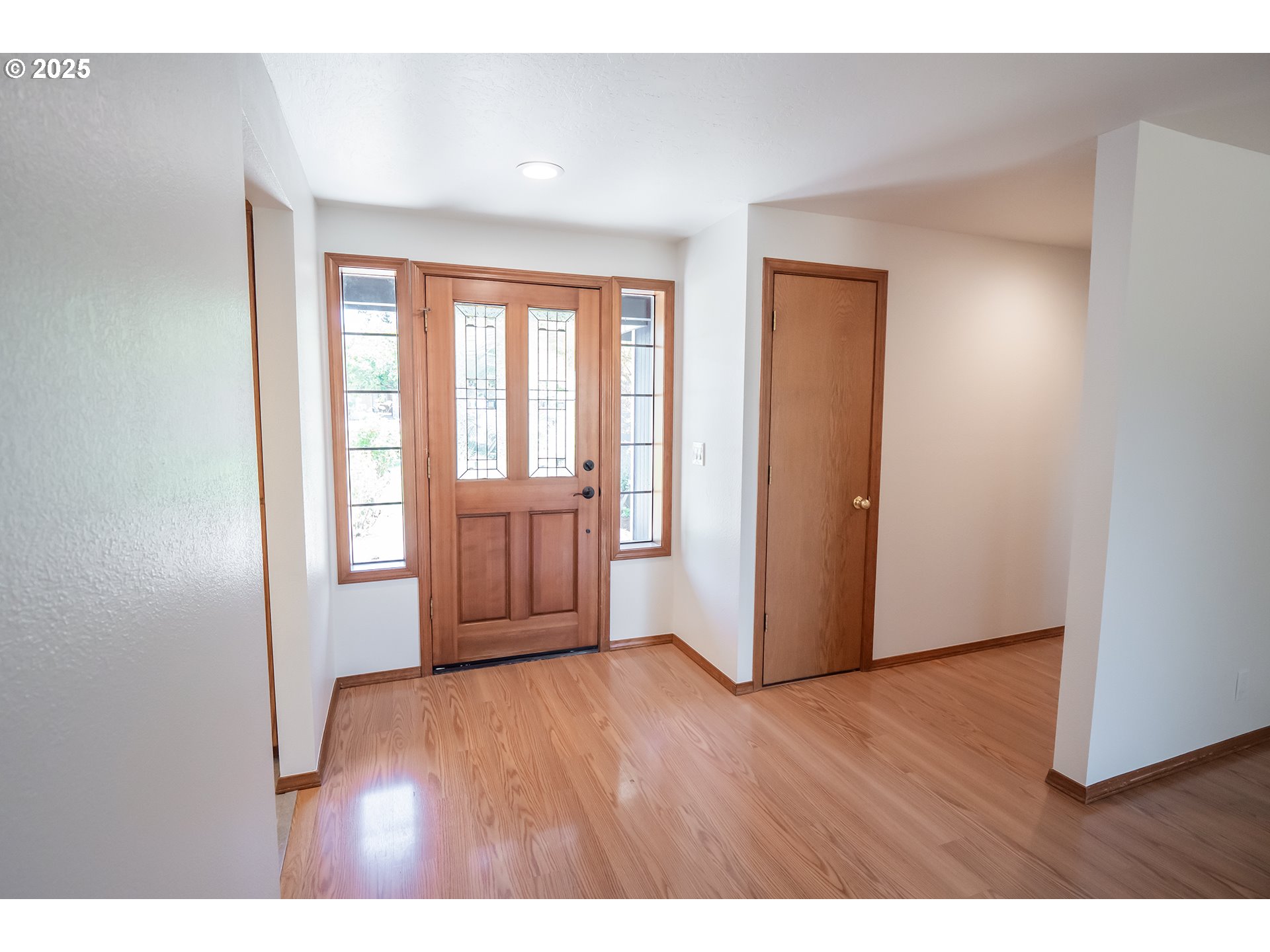 6894 C Street Springfield, OR 97478 - Photo 3 of 32 a view of an empty room with wooden floor and a window