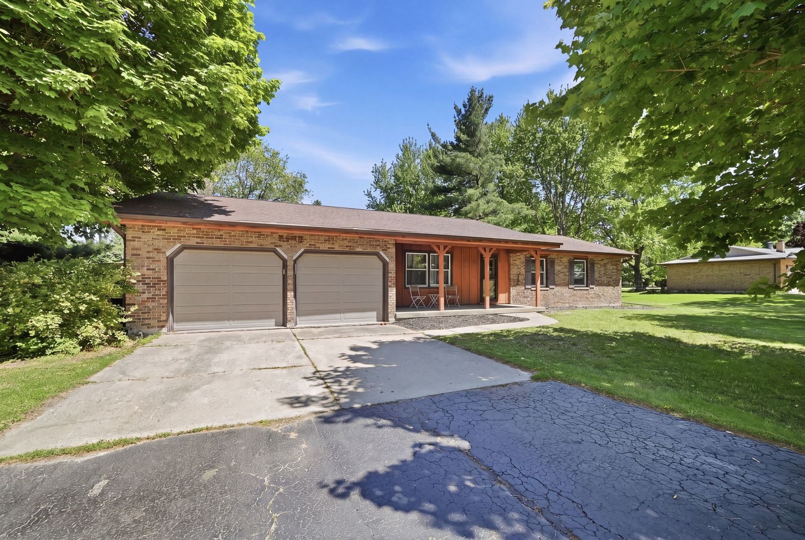 5645 Beebe Drive Rochelle, IL 61068 - Photo 3 of 43 a front view of a house with a yard and garage