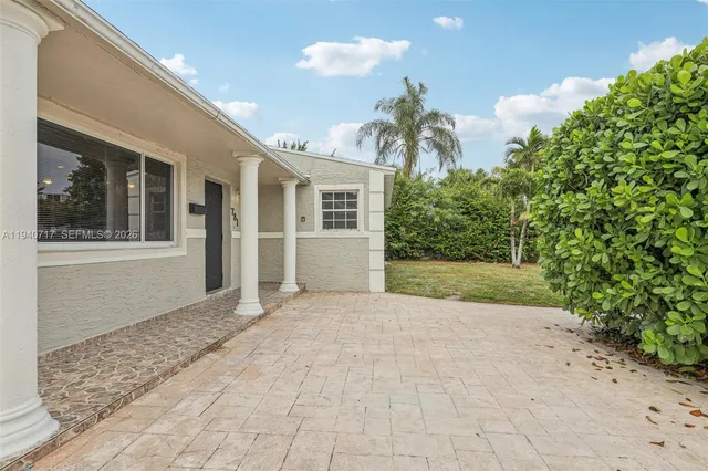a bathroom with a shower and a sink