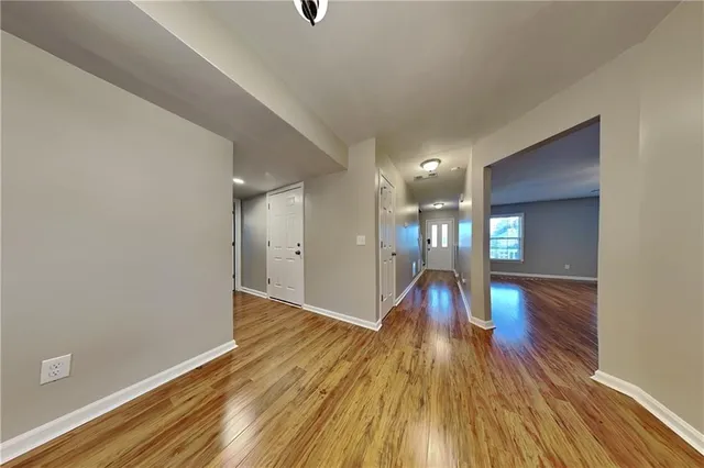 a view of gallery with wooden floor