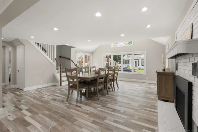 a view of a dining room with furniture window and wooden floor