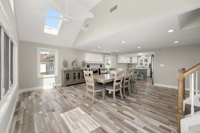 a large kitchen with a table and chairs in it