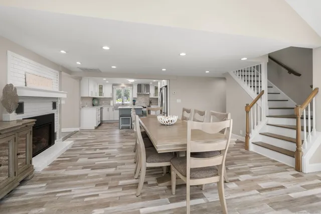a view of a dining room with furniture and wooden floor