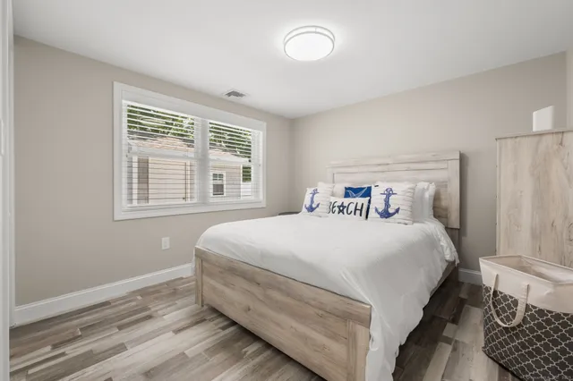 a bathroom with a double vanity sink a shower and a mirror