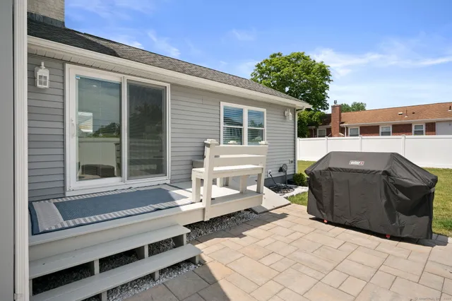 a view of a patio with couches and potted plants
