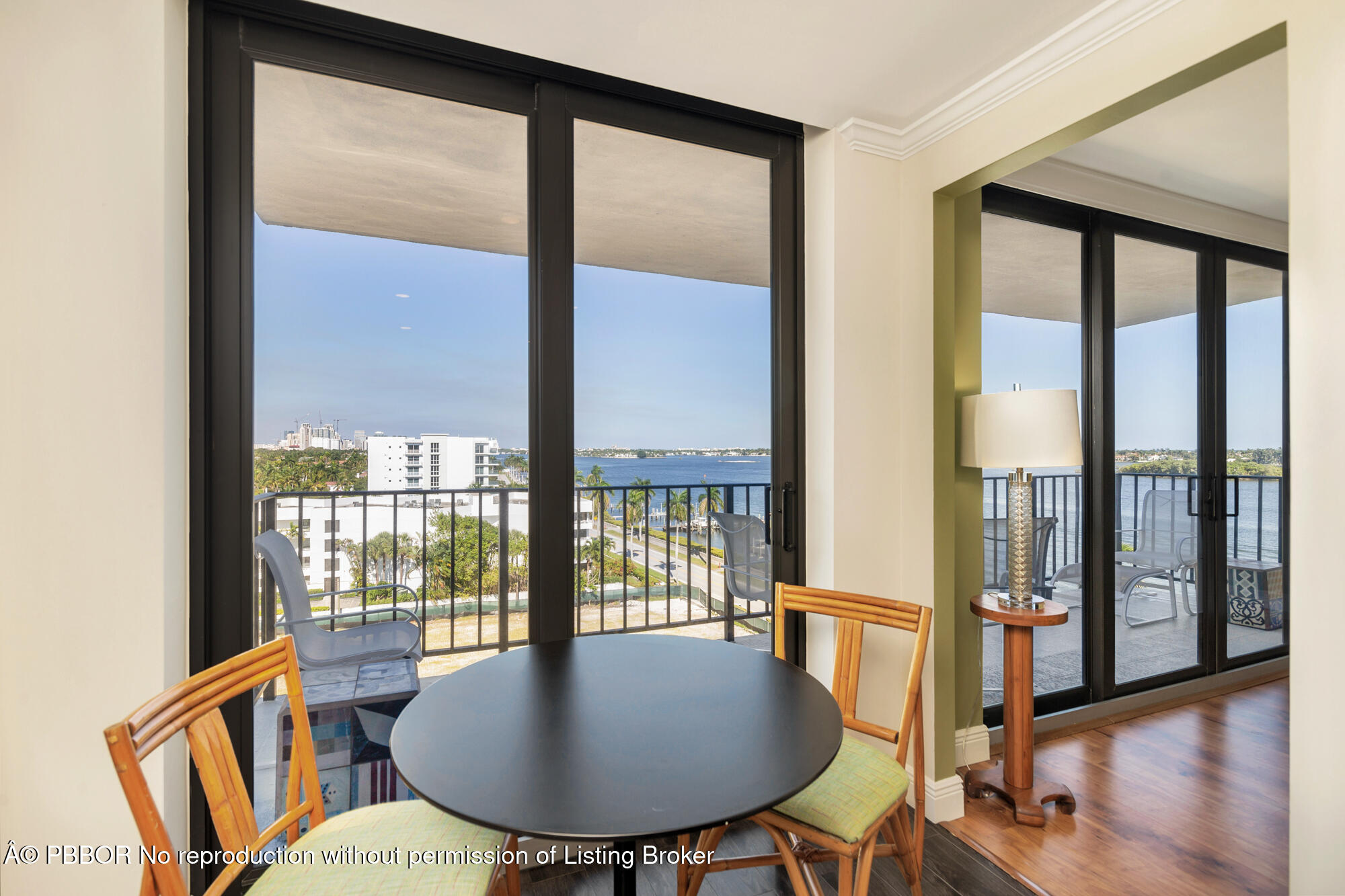 3800 Washington Road, Unit 808 West Palm Beach, FL 33405 - Photo 11 of 35 a dining room with furniture window and wooden floor