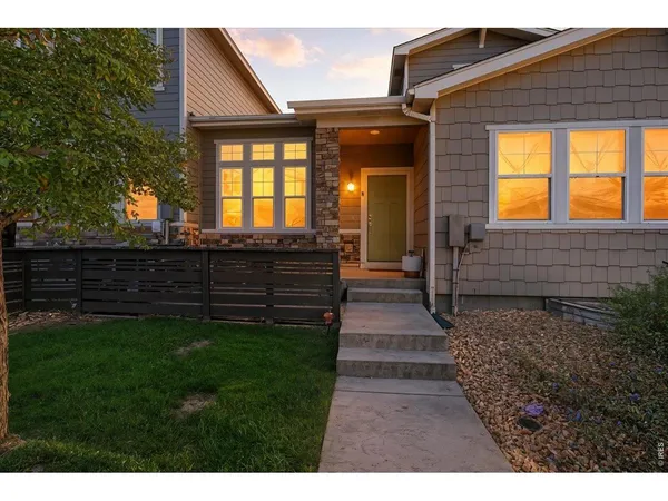 a view of front door of house with stairs