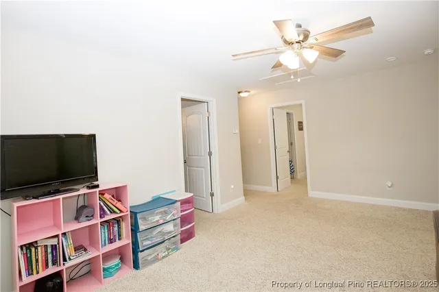 a room with furniture and a flat screen tv