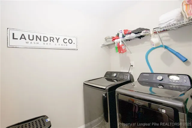 a utility room with dryer and washer