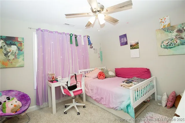 a bedroom with a bed and furniture