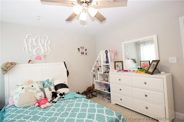 a bedroom with a baby bed baby crib and a dresser