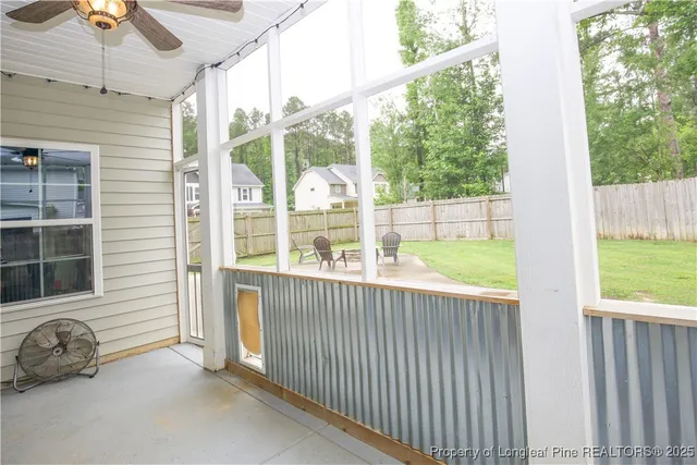 a view of a porch with furniture and garden