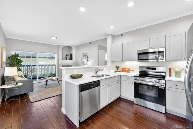 a kitchen with a sink stove and refrigerator
