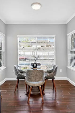 a view of a dining room with furniture window and wooden floor