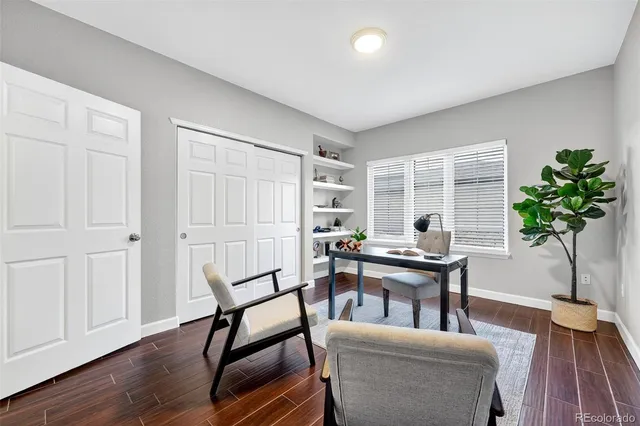 a view of a livingroom with furniture and a potted plant