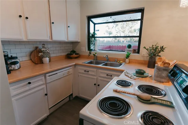 a kitchen with a sink and cabinets