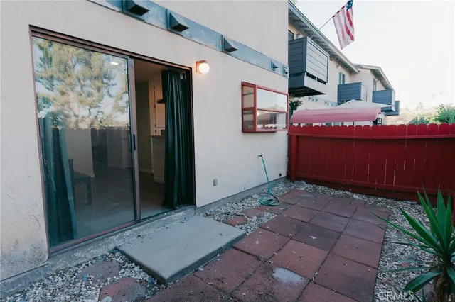 a wooden bench sitting in front of a building