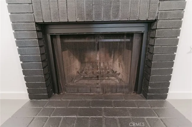 a kitchen with a stove a sink and a window