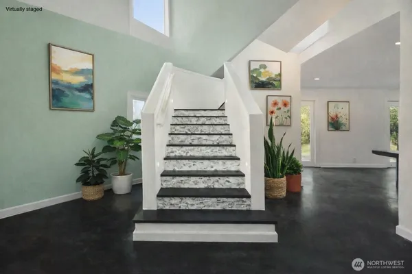 a view of entryway and hall with wooden floor