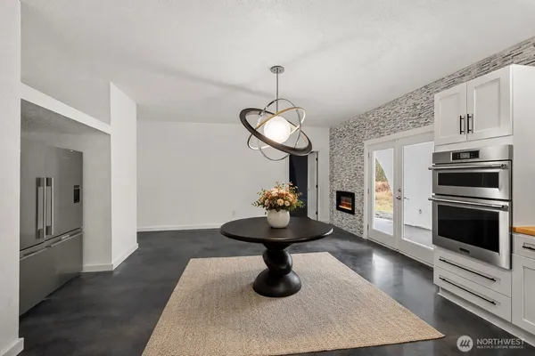 a kitchen with stainless steel appliances a sink and a stove