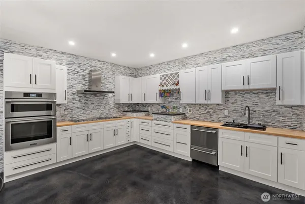 a view of a hallway with paintings on the wall