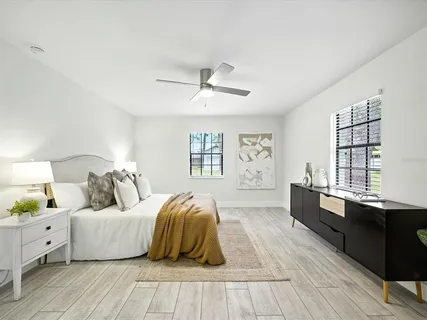 a bedroom with a bed and window