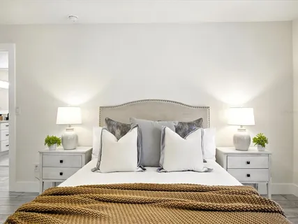 a spacious bathroom with a shower sink mirror and toilet