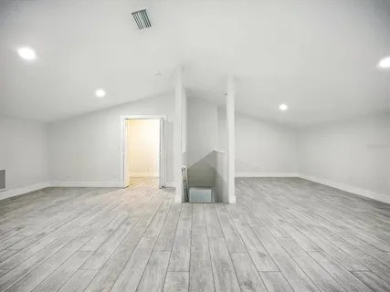 a view of a backyard with large trees