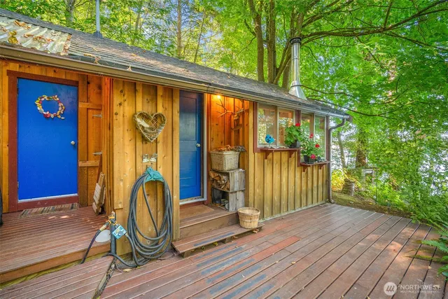 a view of a porch with wooden floor and stairs
