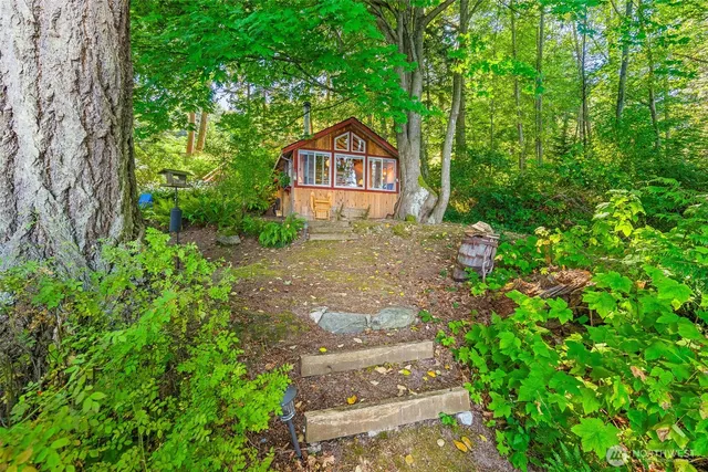 a couple of potted plants in front of a house