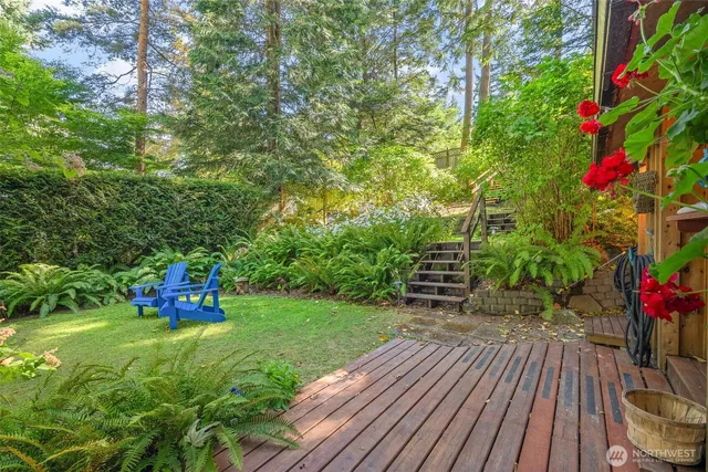a living room with patio furniture and a floor to ceiling window