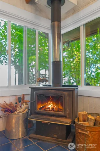 a view of a lake with a table and chairs