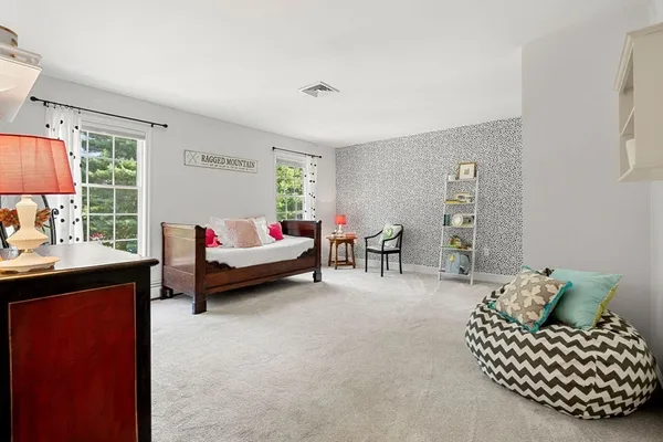 a bedroom with furniture and a couch