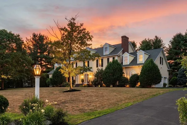 a view of a street with a building in the background