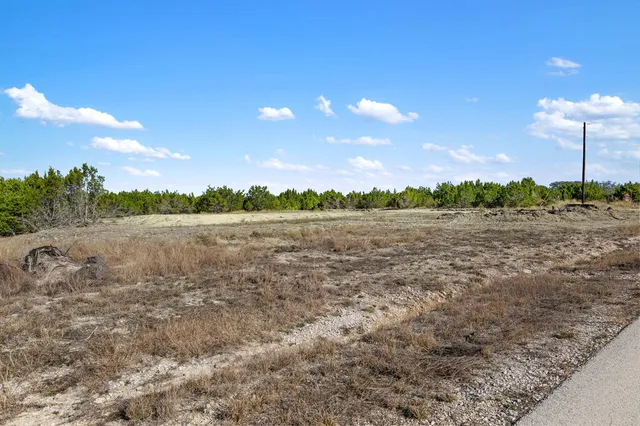 a view of a lake with sunset