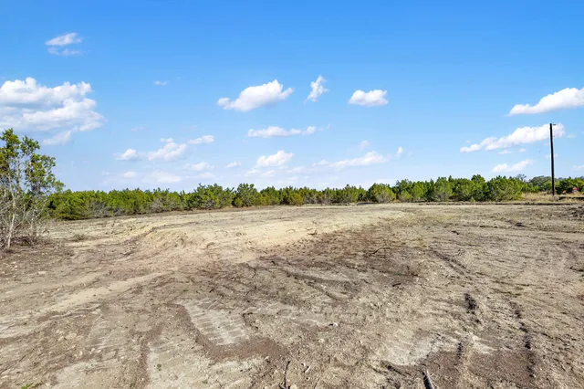 a view of lake with sunset