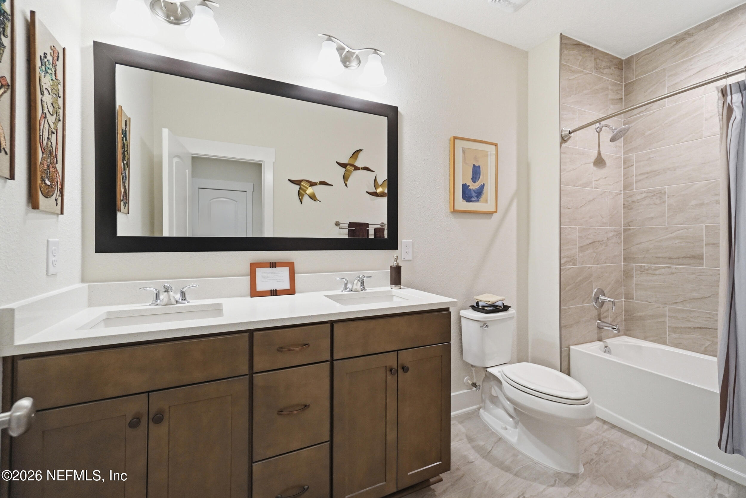 34 Red Rock Lane St. Johns, FL 32259 - Photo 37 of 71 a bathroom with a toilet a sink a mirror a vanity and shower
