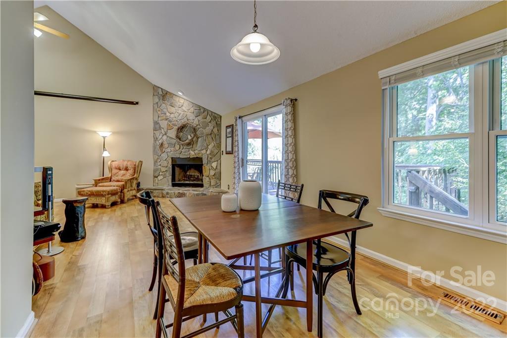 6023 Lanai Lane Tega Cay, SC 29708 - Photo 11 of 43 a view of a dining room with furniture window and wooden floor