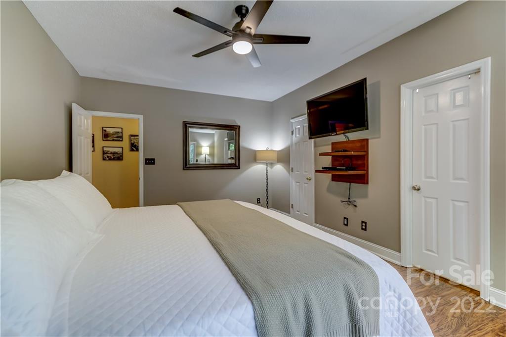 6023 Lanai Lane Tega Cay, SC 29708 - Photo 22 of 43 a bedroom with a bed and a flat screen tv
