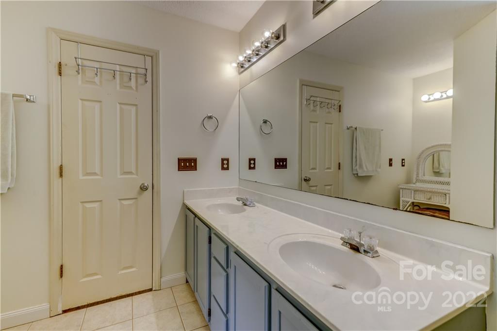 6023 Lanai Lane Tega Cay, SC 29708 - Photo 24 of 43 a bathroom with a sink double vanity and a mirror