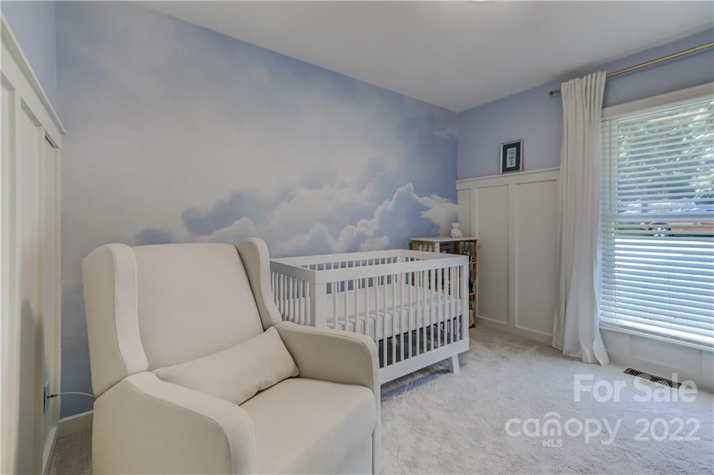 6023 Lanai Lane Tega Cay, SC 29708 - Photo 27 of 43 a bedroom with a bed and a window