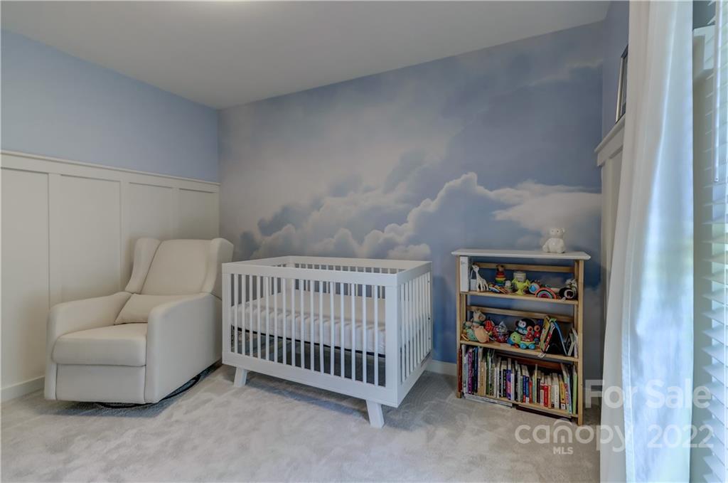 6023 Lanai Lane Tega Cay, SC 29708 - Photo 28 of 43 a bedroom with furniture and baby