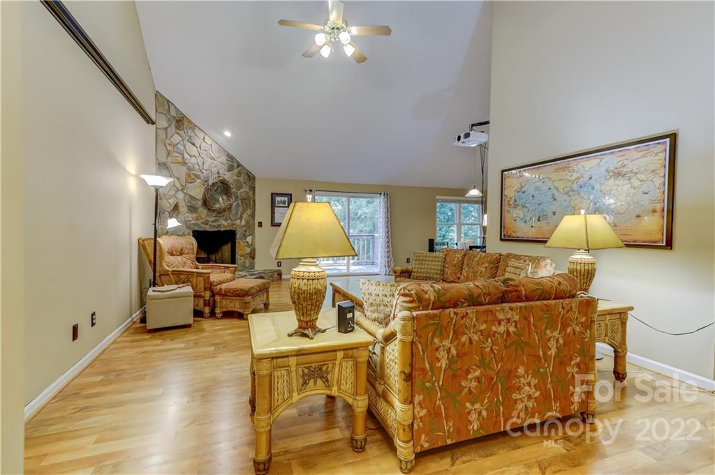 6023 Lanai Lane Tega Cay, SC 29708 - Photo 3 of 43 a living room with furniture and a chandelier
