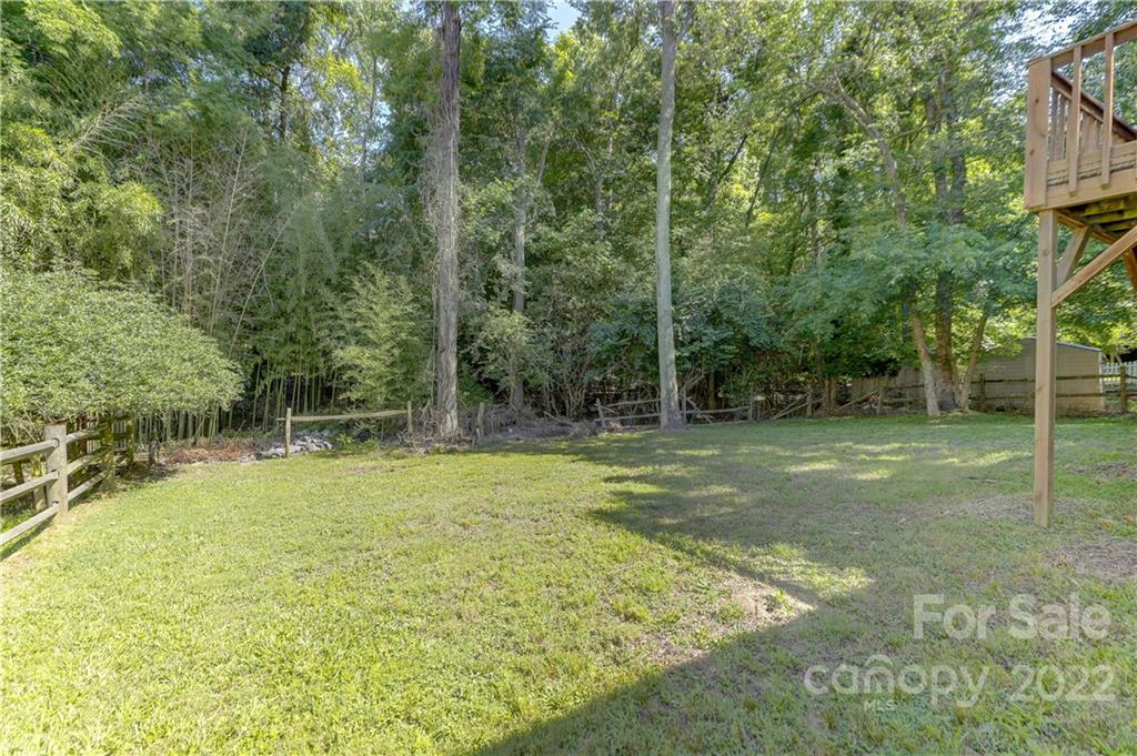 6023 Lanai Lane Tega Cay, SC 29708 - Photo 36 of 43 a view of a yard with a tree