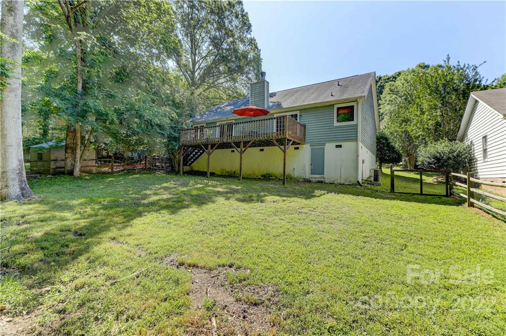 6023 Lanai Lane Tega Cay, SC 29708 - Photo 37 of 43 a view of a house with backyard and tree
