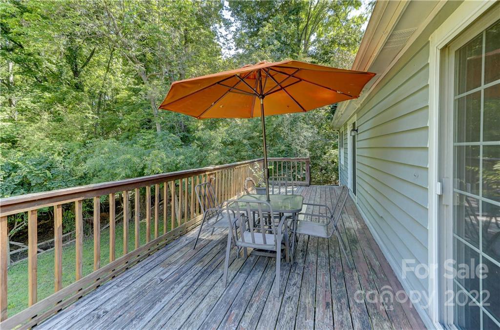 6023 Lanai Lane Tega Cay, SC 29708 - Photo 41 of 43 a view of balcony with outdoor seating and wooden floor
